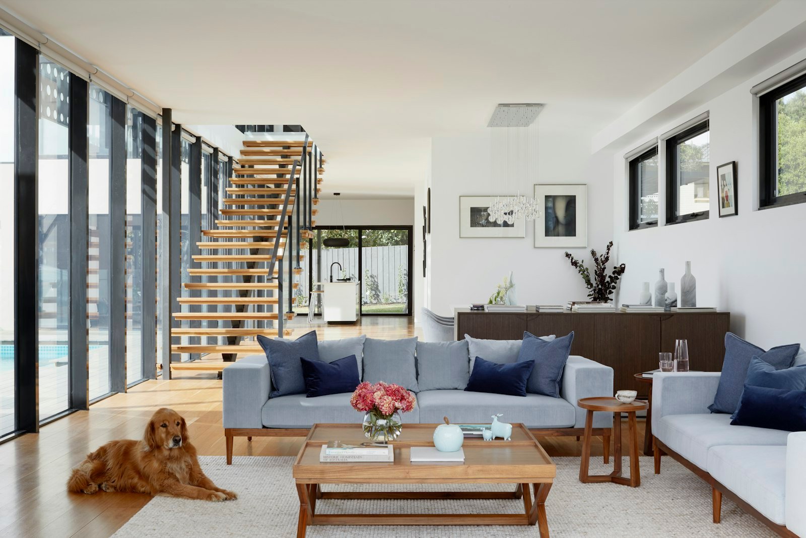 Open living room with floating wood staircase